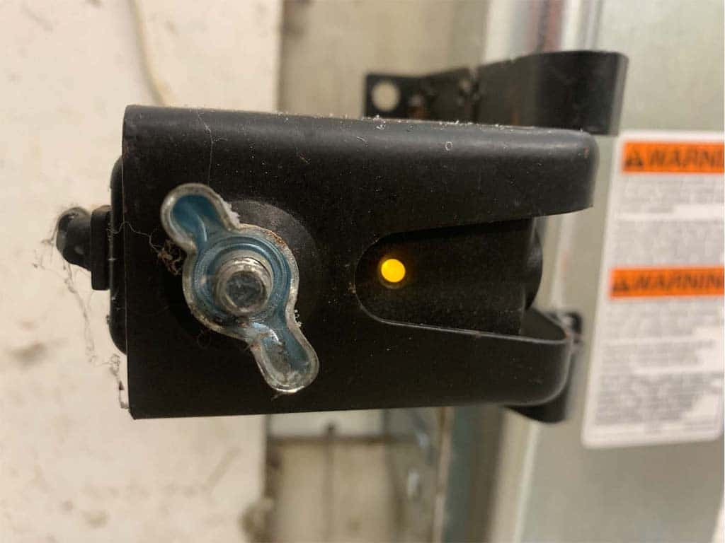 How to Line Up a Garage Door Safety Sensor Eye